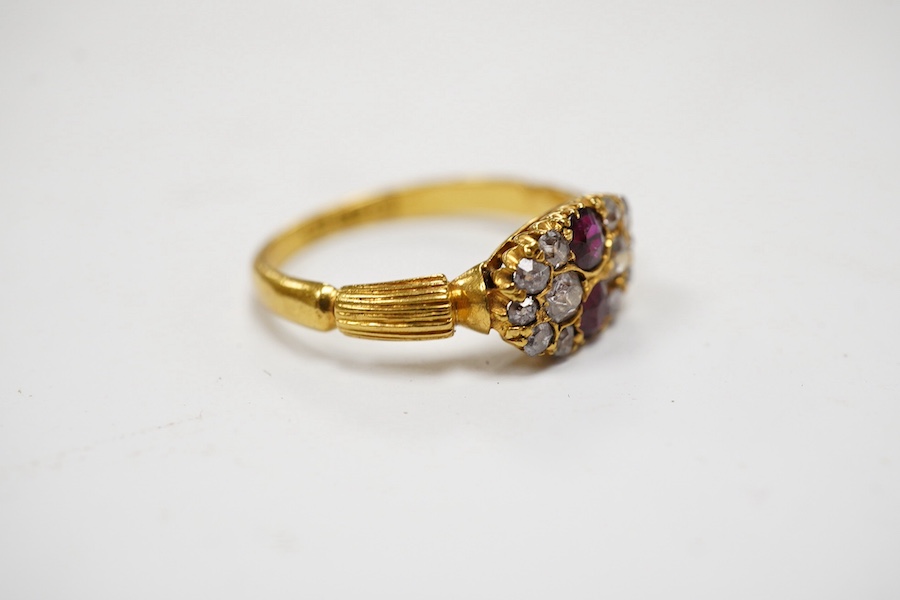 An early 20th century 18ct gold, ruby and diamond cluster ring, size J, gross weight 2.6 grams. Condition - fair